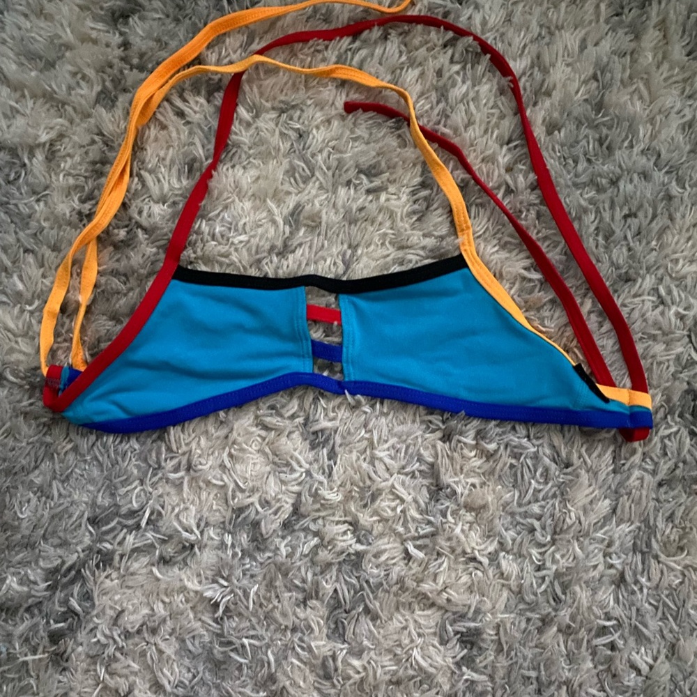 An extra small blue bikini top from Jolyn clothing.